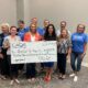 Cherokee Association of REALTORS Presents a Donation to Habitat for Humanity at Cherokee County Housing Forum